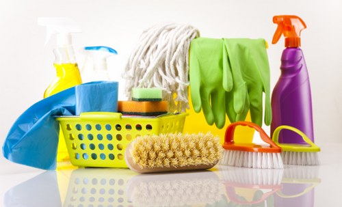 Cleaning staff inspecting flooring and managing slip risks