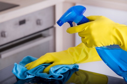 Technician carrying out upholstery cleaning on a living room chair
