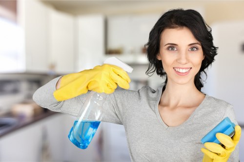Professional carpet cleaners working with PPE and safety procedures in place