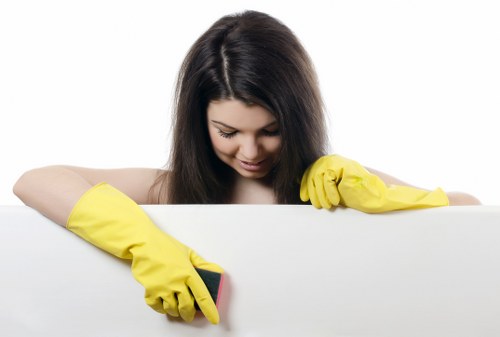 Staff member using protective gloves during a carpet cleaning task